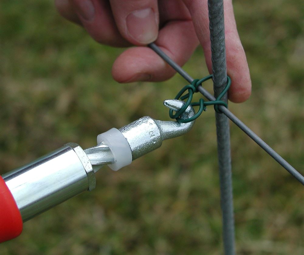 Shown applying Twist Wire (available separately) to vine support (available separately) and wire