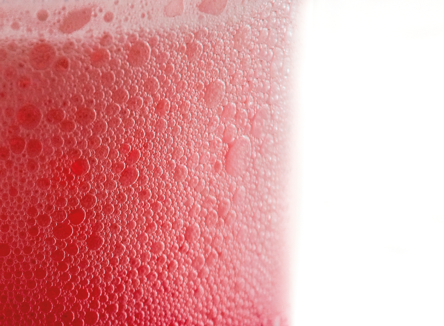 Close up of red carbonated drink